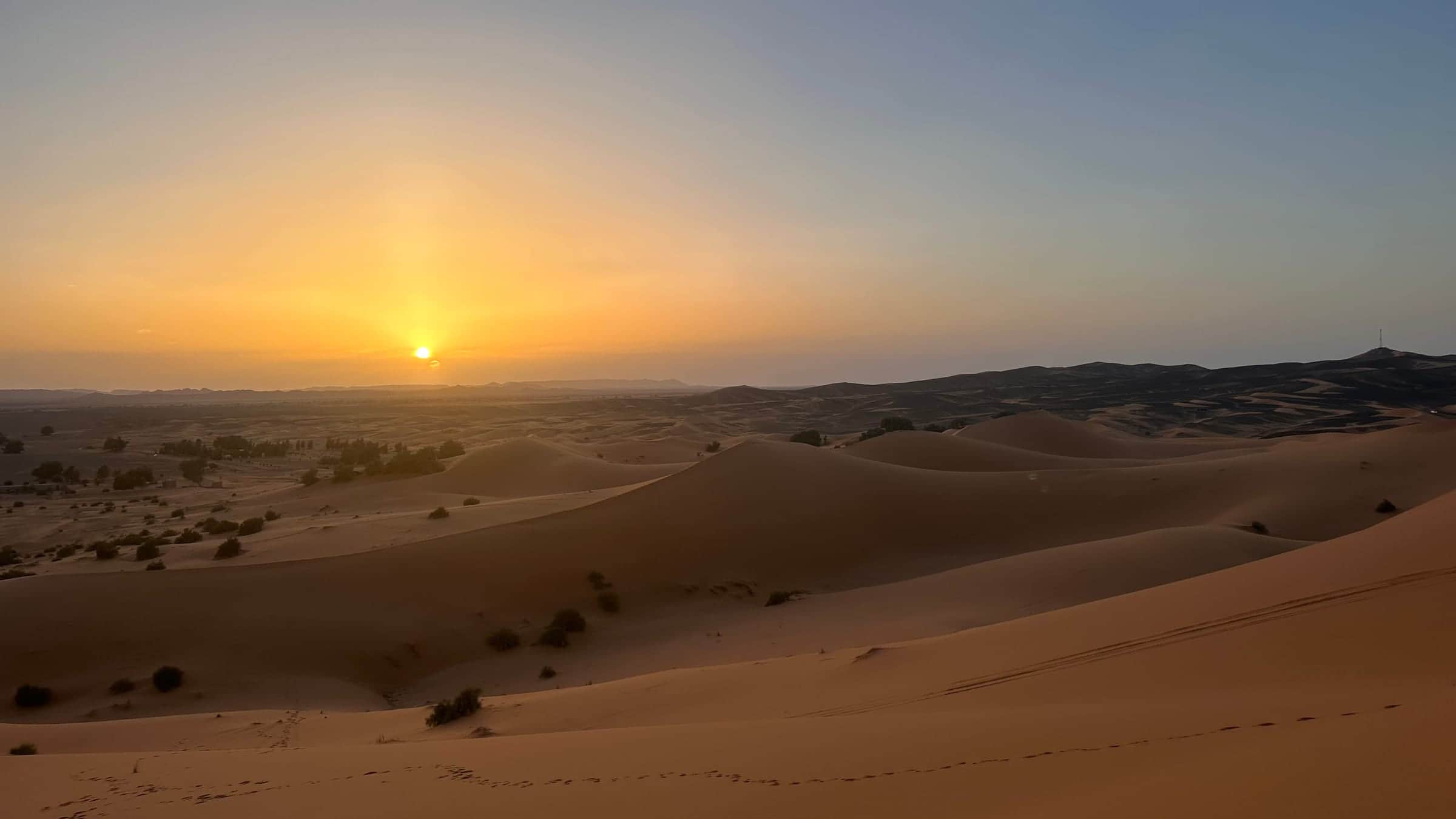 Sun setting over the Sahara dunes